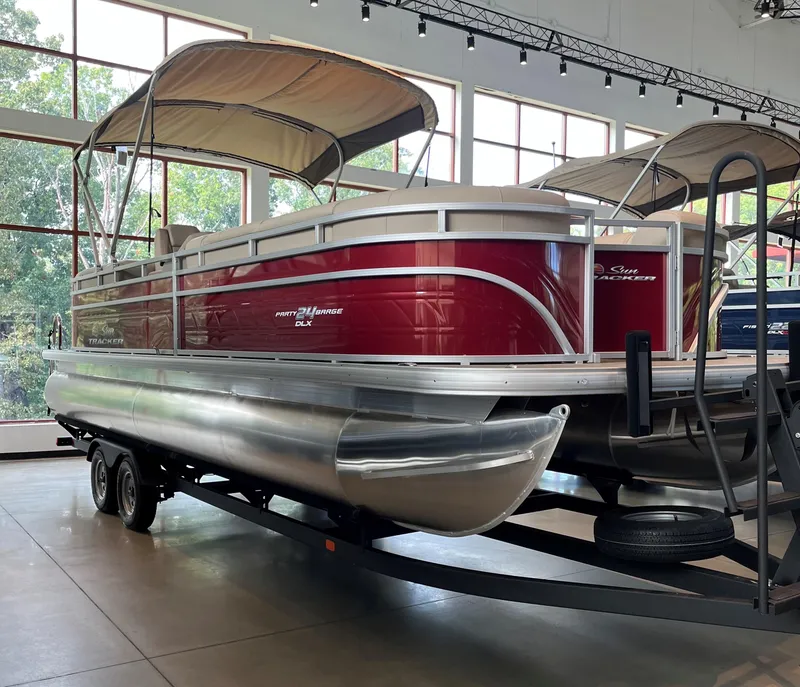 The Image of 2024 Sun Tracker Party Barge 24 DLX pontoon boat in showroom. - 0