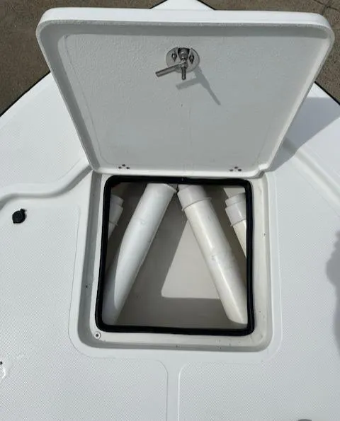 Slide: The Image of Open storage compartment on a 2024 Mako 18 LTS boat. - 10