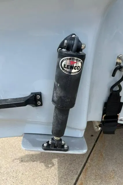 Slide: The Image of Close-up of Lenco trim tab on 2024 Mako 18 LTS boat. - 14
