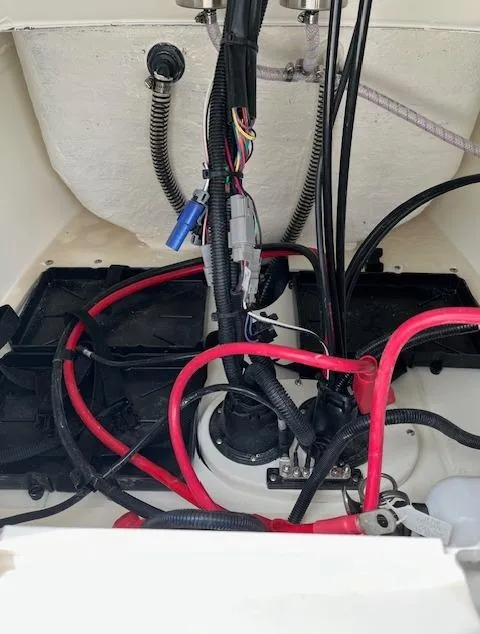 Slide: The Image of 2024 Mako 18 LTS boat wiring and engine compartment. - 17