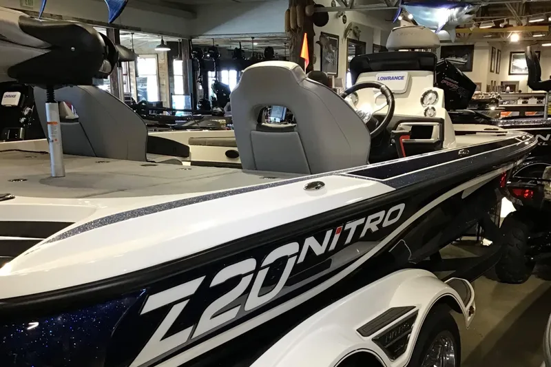 Slide: The Image of 2024 Nitro Z20 boat in showroom, featuring sleek design and modern seating. - 1
