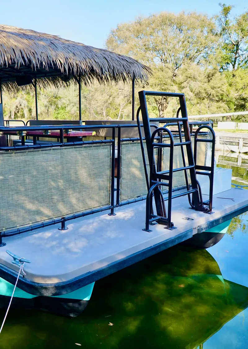 Slide: The Image of 2024 A&M Manufacturing BullDog 34 pontoon boat with ladder and canopy. - 17