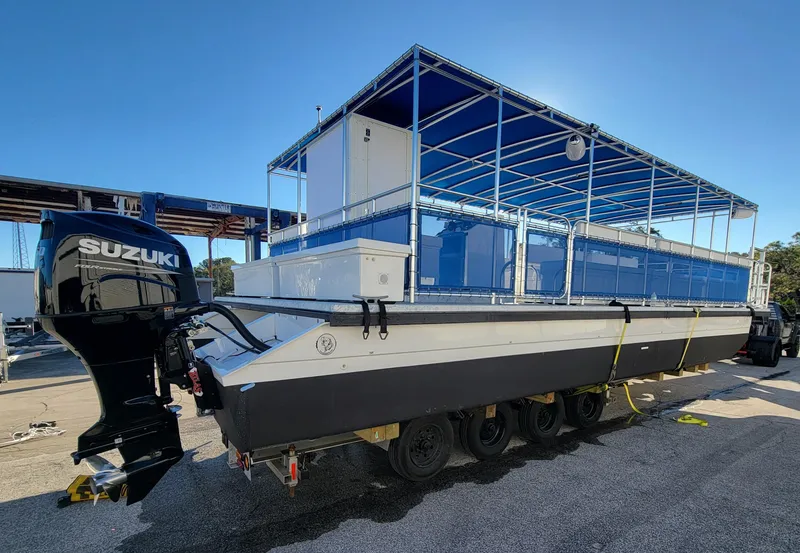 Slide: The Image of 2024 A&M Manufacturing BullDog 34 boat with Suzuki outboard motor. - 21