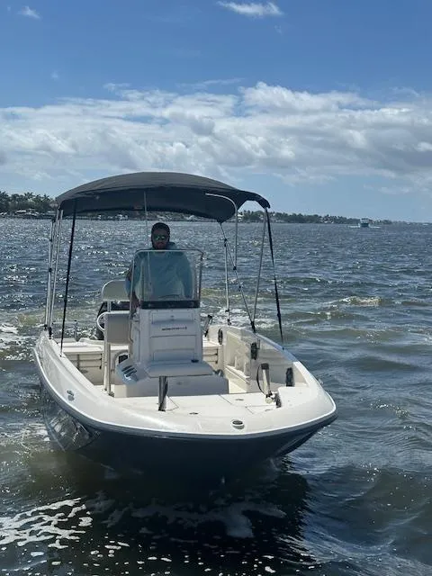 Slide: The Image of 2016 Bayliner F18 Element boat on open water under a sunny sky. - 4