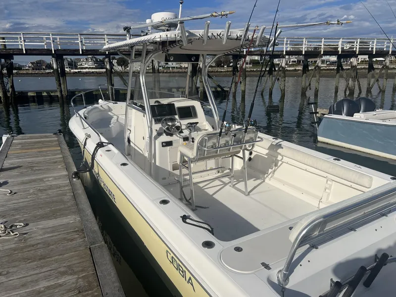 Slide: The Image of 2005 Cobia 314 Center Console boat docked at marina. - 2