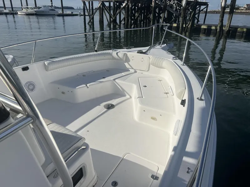 Slide: The Image of 2005 Cobia 314 Center Console boat with spacious deck and seating area. - 5