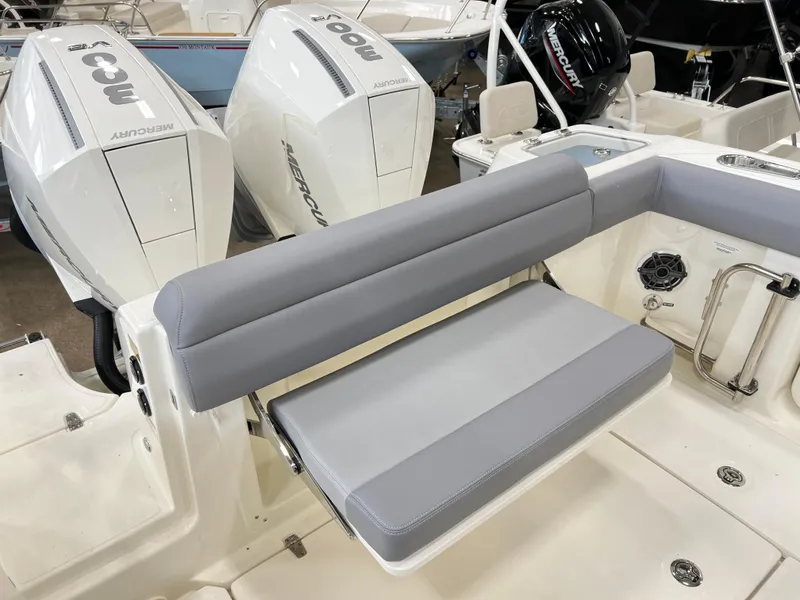 Slide: The Image of 2024 Boston Whaler 280 Outrage boat with dual Mercury outboard engines and cushioned seating. - 3