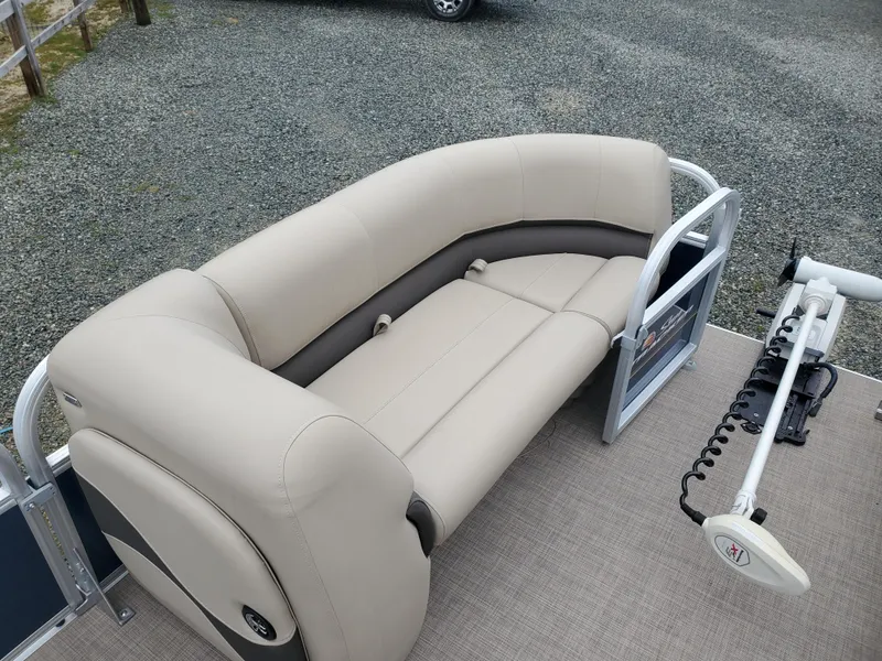 Slide: The Image of 2022 Sun Tracker Party Barge 18 DLX with beige seating and trolling motor. - 8