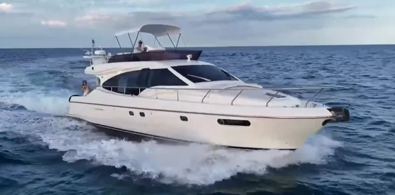 Slide: The Image of 2009 Ferretti Yachts 470 cruising on open sea, showcasing sleek design and luxury. - 0