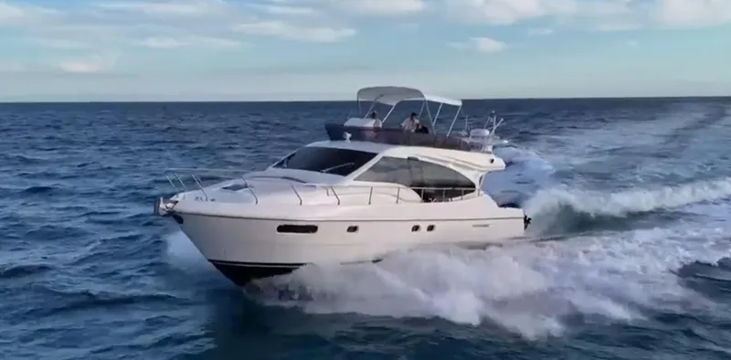 Slide: The Image of 2009 Ferretti Yachts 470 cruising on open sea, showcasing sleek design and performance. - 1