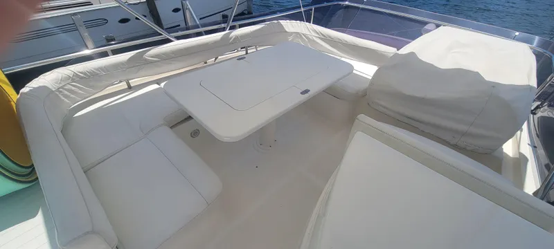 Slide: The Image of 2009 Ferretti Yachts 470 interior with white seating and table. - 14