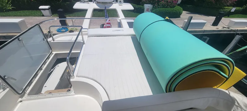 Slide: The Image of Ferretti Yachts 470, 2009 model, deck view with rolled mats and open storage. - 15