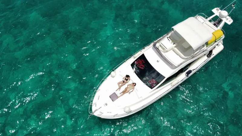 Slide: The Image of Aerial view of 2009 Ferretti Yachts 470 on turquoise water. - 2