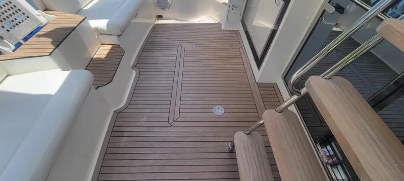 Slide: The Image of Interior of 2009 Ferretti Yachts 470 with wooden flooring and seating area. - 24