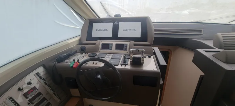 Slide: The Image of Cockpit of 2009 Ferretti Yachts 470 with Garmin navigation displays. - 31