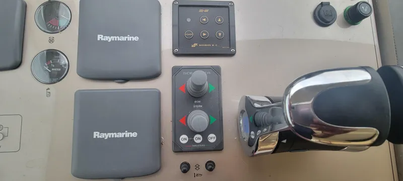 Slide: The Image of Control panel of a 2009 Ferretti Yachts 470 with Raymarine equipment. - 34