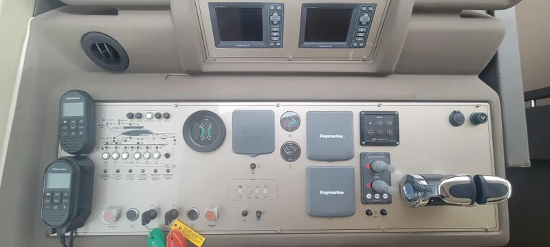 Slide: The Image of Control panel of a 2009 Ferretti Yachts 470 with navigation instruments and controls. - 35