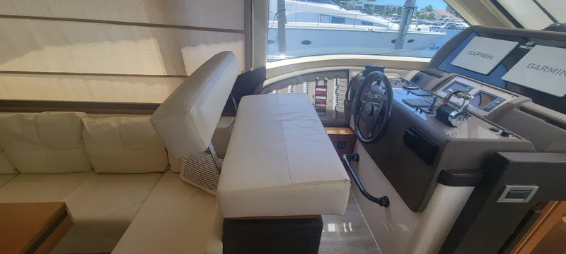 Slide: The Image of Interior of 2009 Ferretti Yachts 470 with helm station and seating area. - 37
