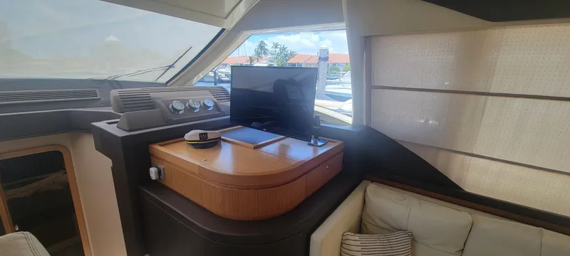Slide: The Image of Interior of 2009 Ferretti Yachts 470 with modern dashboard and seating area. - 40