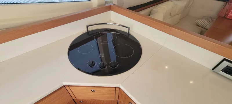 Slide: The Image of Modern kitchen area on 2009 Ferretti Yachts 470 with sleek stovetop. - 45