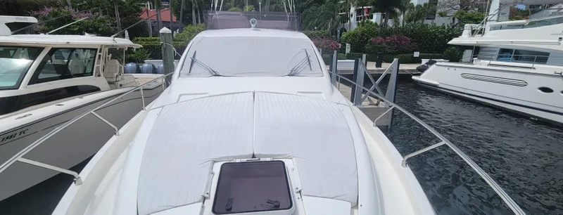 Slide: The Image of 2009 Ferretti Yachts 470 docked, showcasing sleek design and luxury features. - 7