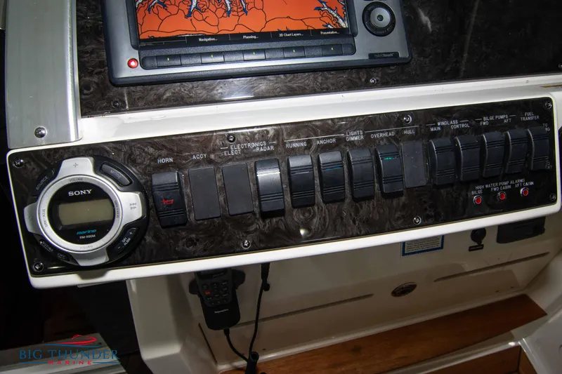Slide: The Image of Control panel of a 2012 Sea Ray 410 Sundancer with navigation and audio system. - 32