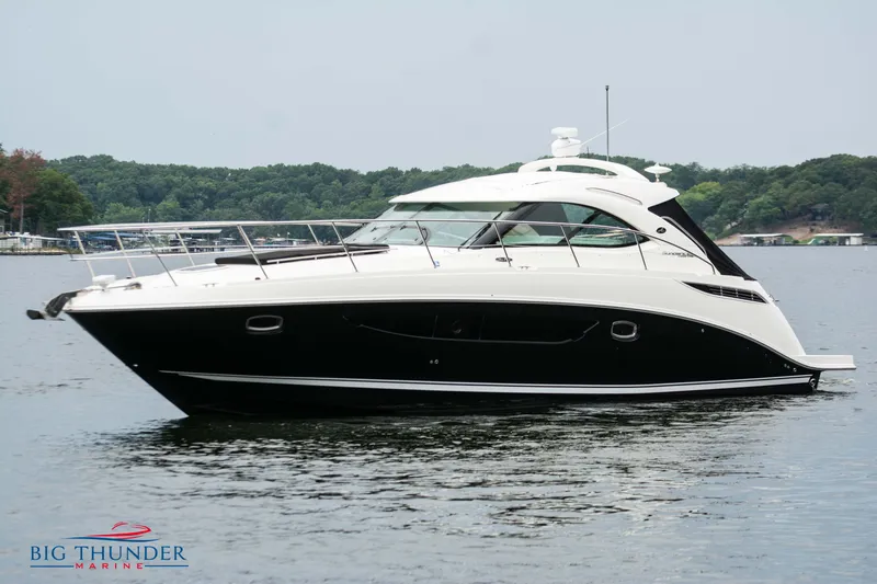 Slide: The Image of 2012 Sea Ray 410 Sundancer yacht on calm water, side view. - 4