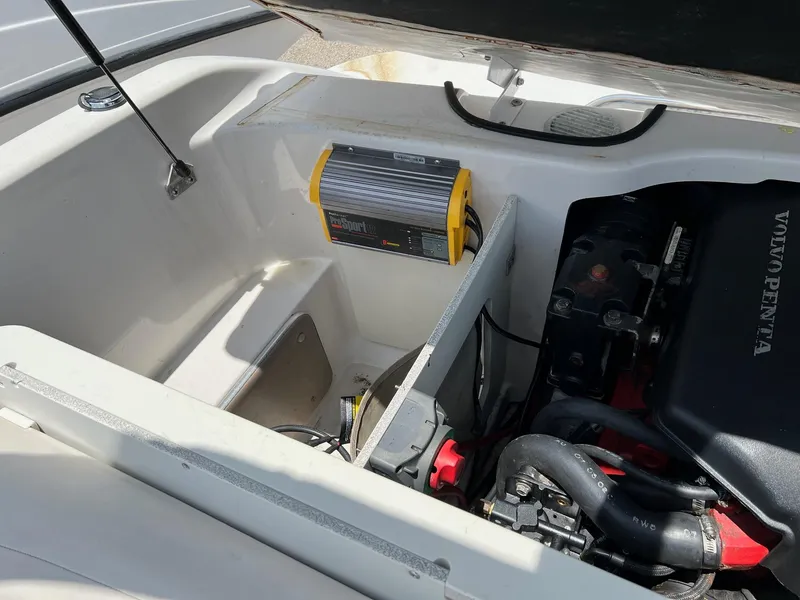 Slide: The Image of 2003 Four Winns 190 Horizon boat engine compartment with Volvo Penta engine. - 12