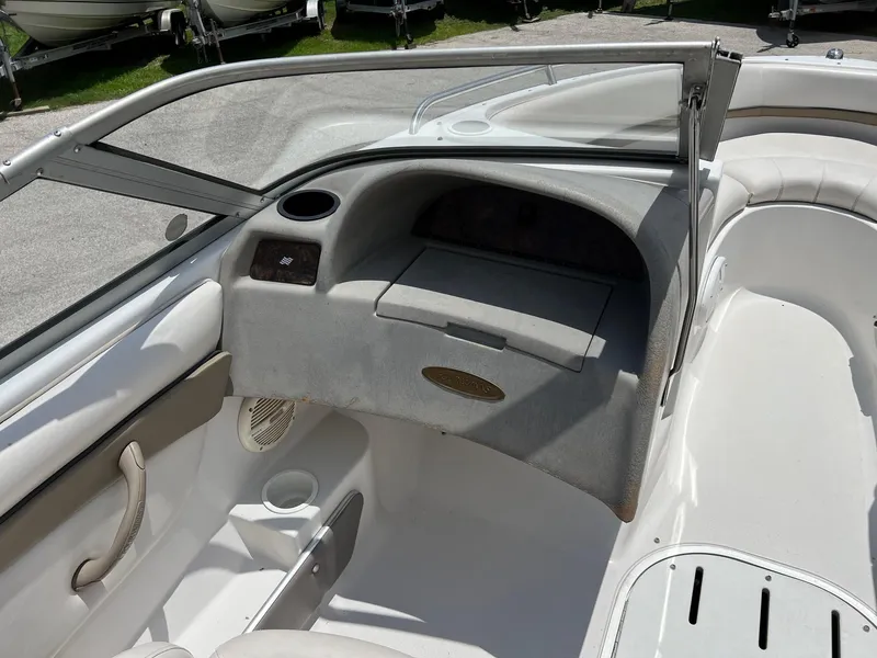 Slide: The Image of 2003 Four Winns 190 Horizon boat interior with open windshield and seating. - 14