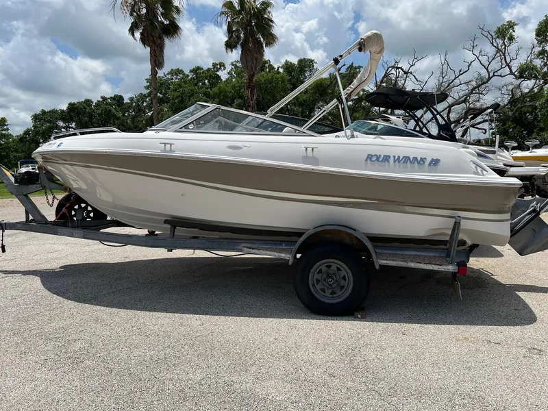 Slide: The Image of 2003 Four Winns 190 Horizon boat on trailer, side view. - 6