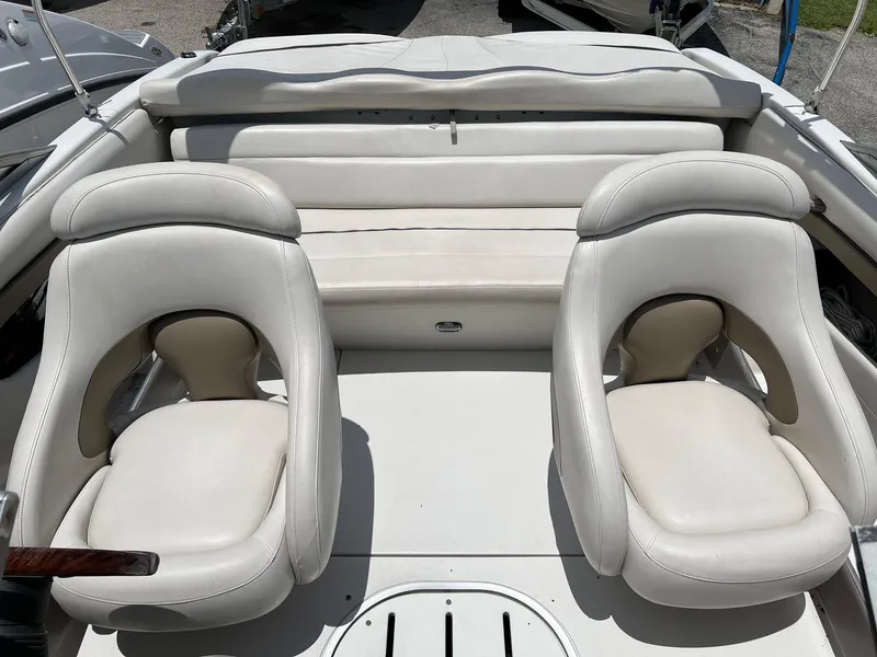 Slide: The Image of 2003 Four Winns 190 Horizon boat interior with white leather seats. - 8