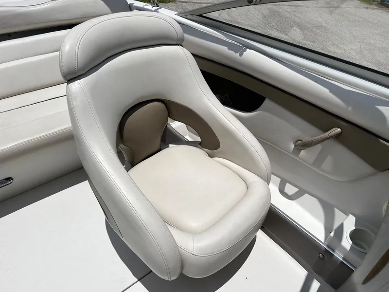 Slide: The Image of 2003 Four Winns 190 Horizon boat interior with white captain's chair. - 9