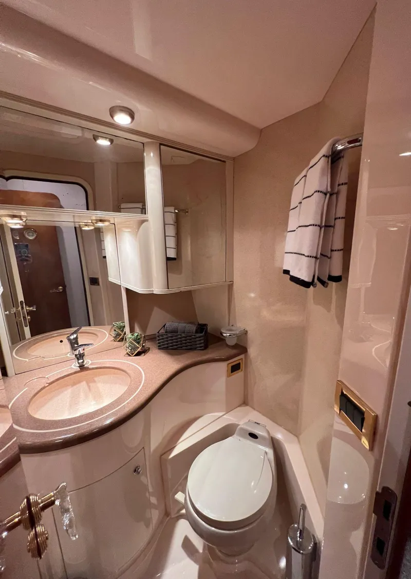 Slide: The Image of Luxurious bathroom in a 2001 Azimut 58 yacht with modern fixtures. - 10