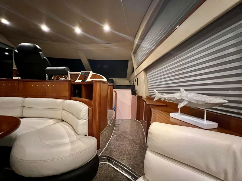 Slide: The Image of Luxurious interior of a 2001 Azimut 58 yacht with leather seating and modern decor. - 13