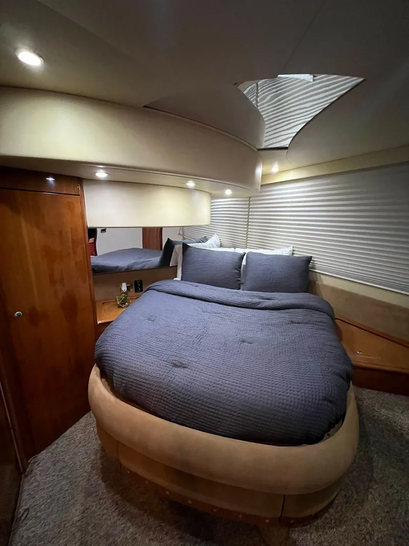 Slide: The Image of Luxurious bedroom interior of a 2001 Azimut 58 yacht with cozy bedding. - 8