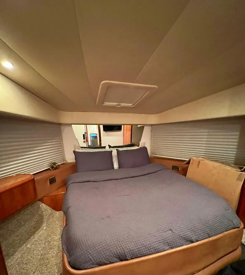 Slide: The Image of Luxurious bedroom in 2001 Azimut 58 yacht with cozy bedding. - 9