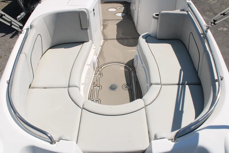 Slide: The Image of 2022 Sea Pro Citation 2400 boat interior with cushioned seating and non-slip flooring. - 6