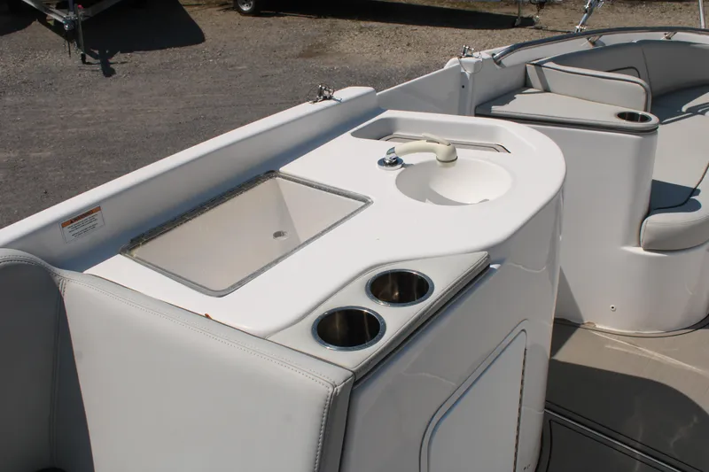 Slide: The Image of 2022 Sea Pro Citation 2400 boat interior with sink and cup holders. - 8