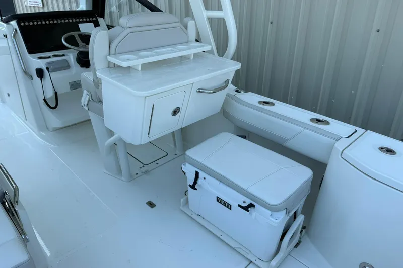 Slide: The Image of Interior of 2025 World Cat 260 DC-X boat with seating and storage. - 10