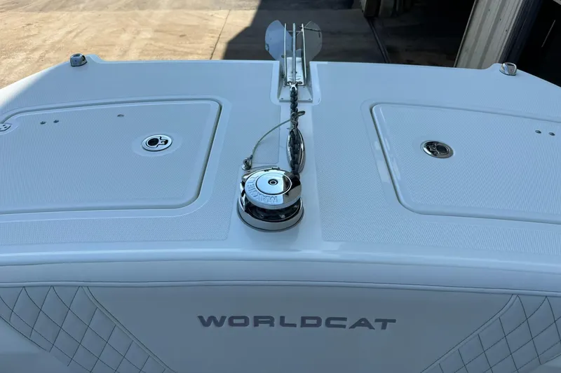 Slide: The Image of 2025 World Cat 260 DC-X boat deck with anchor system and storage compartments. - 16