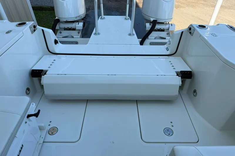 Slide: The Image of 2025 World Cat 260 DC-X boat interior with foldable seating and dual outboard motors. - 21
