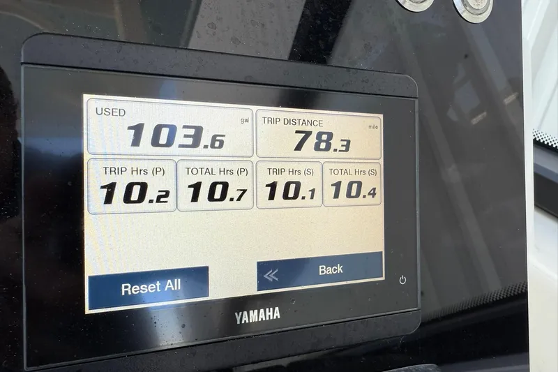 Slide: The Image of Yamaha display showing fuel usage and trip data on 2025 World Cat 260 DC-X boat. - 24