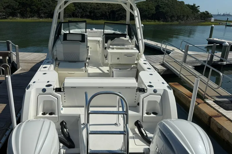Slide: The Image of 2025 World Cat 260 DC-X boat docked, showcasing spacious interior and dual engines. - 4