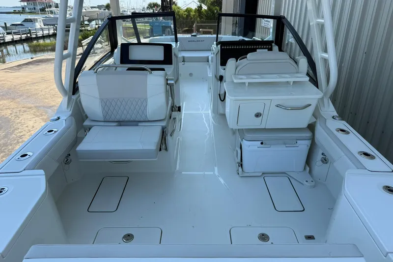 Slide: The Image of 2025 World Cat 260 DC-X boat interior with seating and storage compartments. - 7