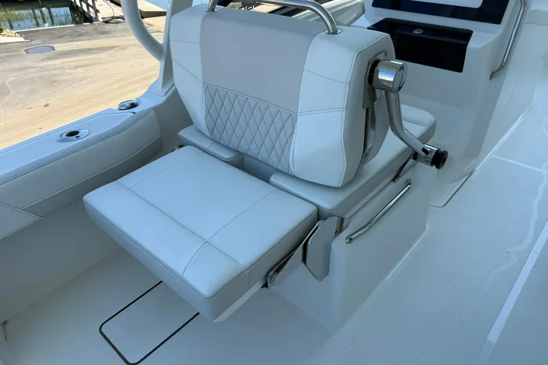 Slide: The Image of Luxury seating on 2025 World Cat 260 DC-X boat, featuring white upholstery and modern design. - 8