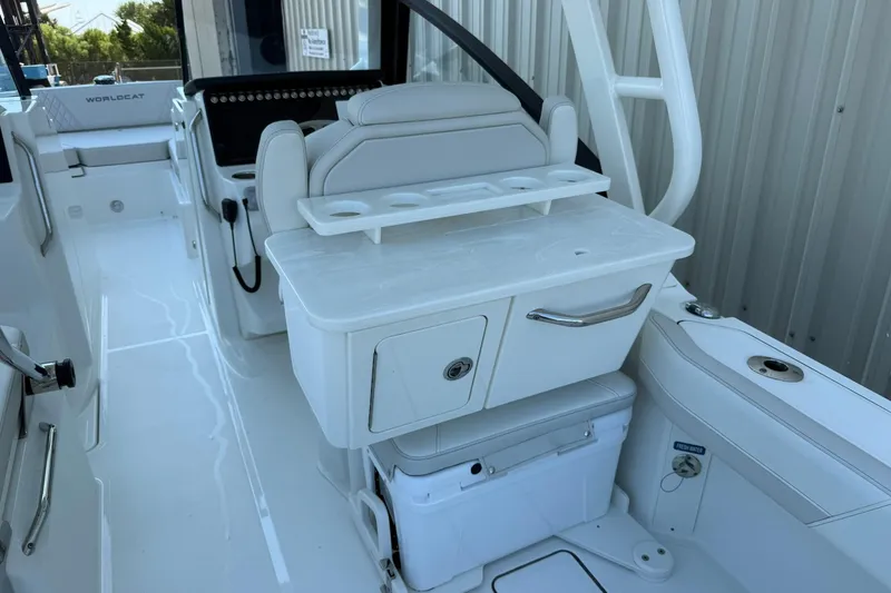 Slide: The Image of 2025 World Cat 260 DC-X boat interior with seating and storage compartments. - 9