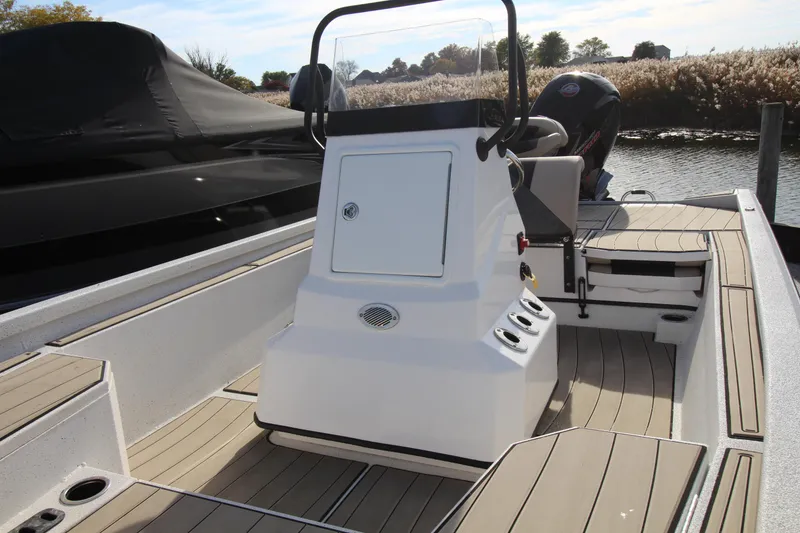 Slide: The Image of 2023 Vexus AVX 2180 CC boat interior with console and seating. - 13