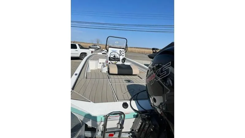 Slide: The Image of 2023 Vexus AVX 2180 CC boat with outboard motor and spacious deck. - 3