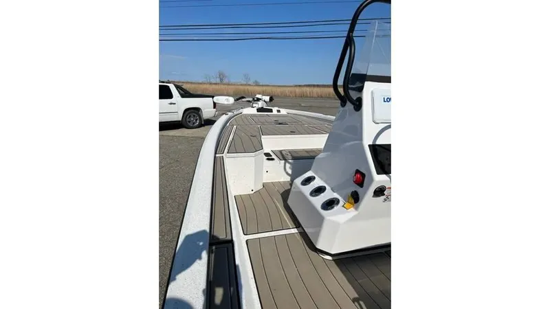 Slide: The Image of 2023 Vexus AVX 2180 CC boat interior with console and deck view. - 4