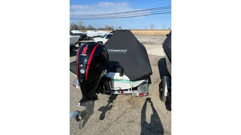 Slide: The Image of 2023 Vexus AVX 2180 CC boat with cover and outboard motor. - 7